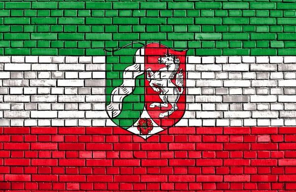 flag of North Rhine-Westphalia painted on brick wall