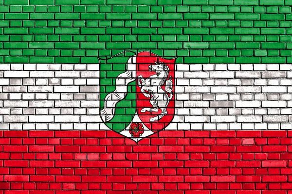 flag of North Rhine-Westphalia painted on brick wall